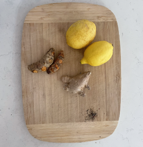 Chopping board lemon turmeric ginger pepper